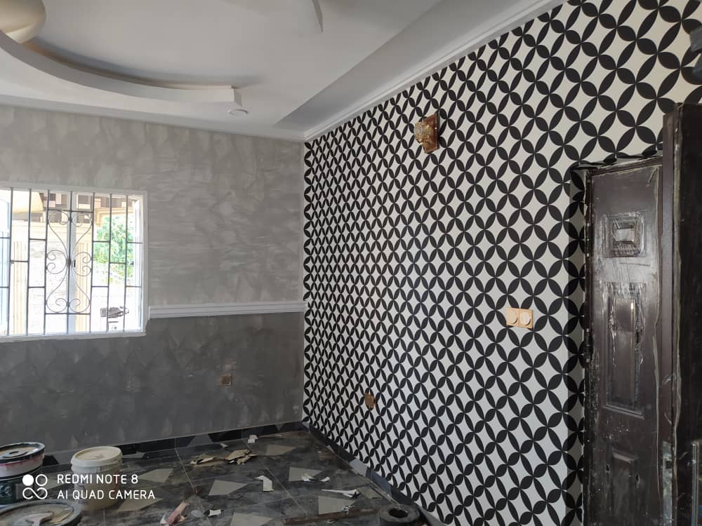 Geometric wallpaper feature wall by Ajis Interior Creations